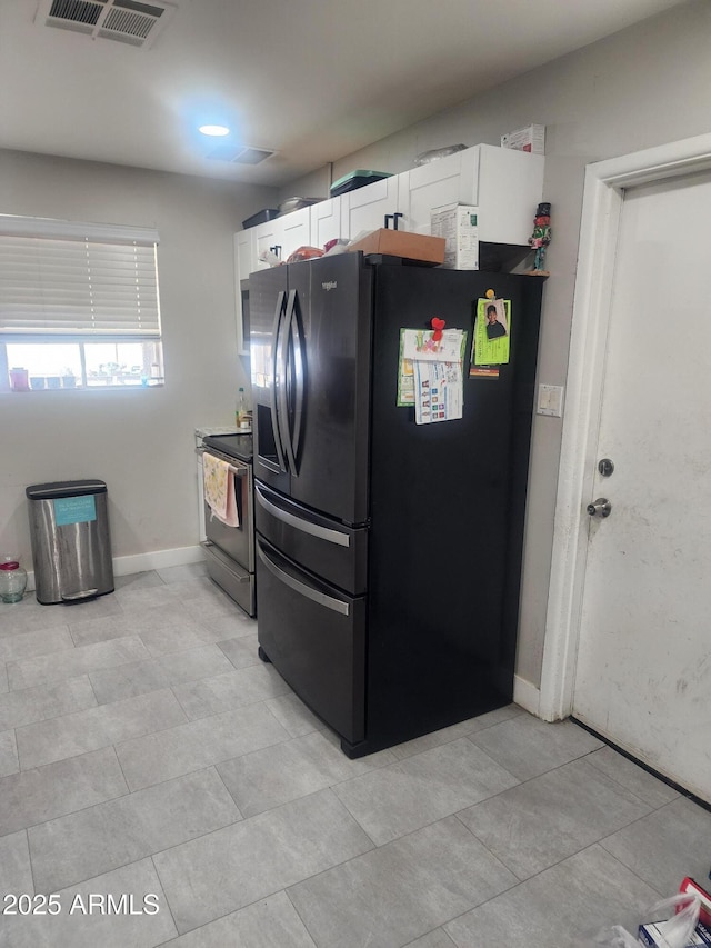 kitchen with visible vents, baseboards, black refrigerator with ice dispenser, electric range, and white cabinets