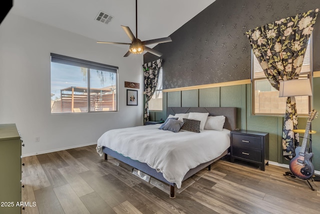 bedroom featuring hardwood / wood-style flooring and ceiling fan