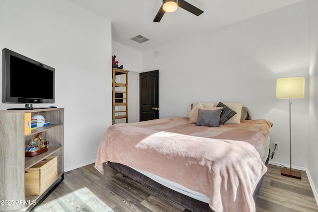 bedroom featuring wood-type flooring and ceiling fan