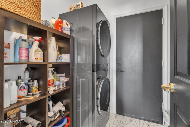 clothes washing area with stacked washer / drying machine