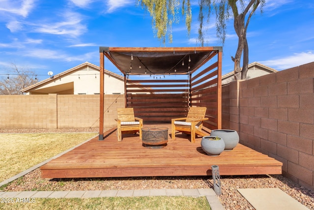 wooden deck featuring a fire pit