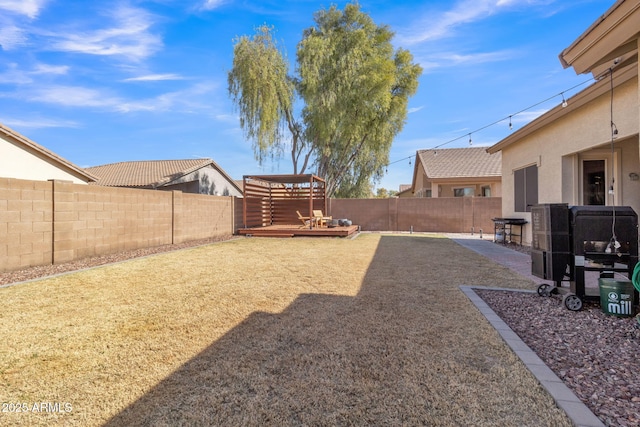 view of yard with a wooden deck