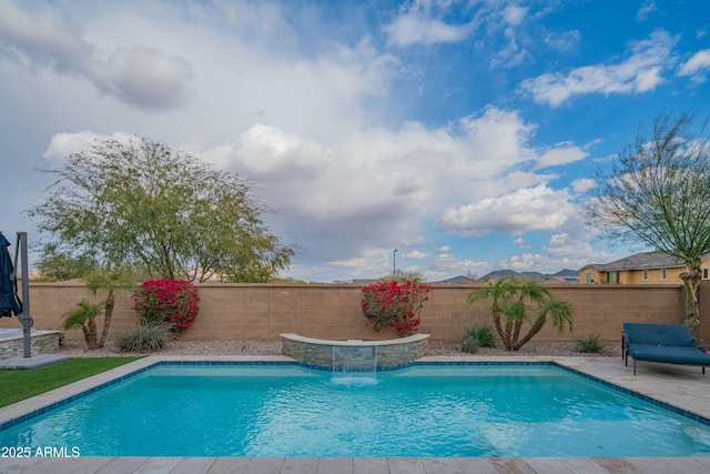 view of swimming pool with pool water feature