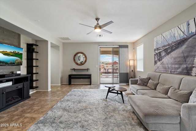 2328 W Calle Marita, Phoenix, AZ 85085 - living area featuring a ceiling fan, tile patterned flooring, and baseboards