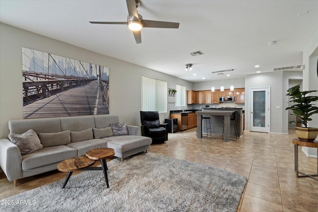 2328 W Calle Marita, Phoenix, AZ 85085 - living area featuring ceiling fan, light tile patterned floors, recessed lighting, and baseboards