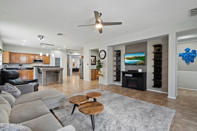 2328 W Calle Marita, Phoenix, AZ 85085 - living area featuring baseboards, a ceiling fan, built in shelves, recessed lighting, and light tile patterned flooring