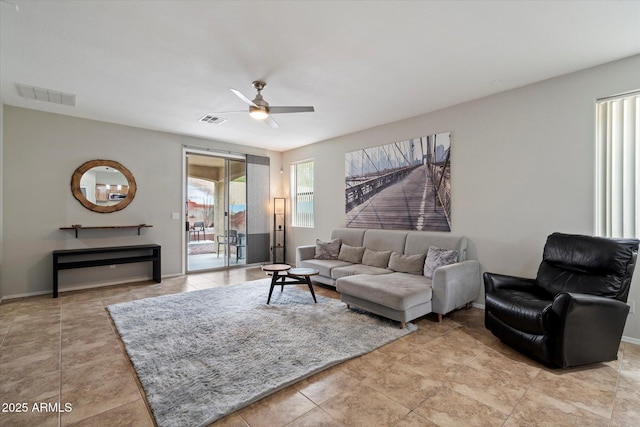 2328 W Calle Marita, Phoenix, AZ 85085 - living area with ceiling fan, light tile patterned floors, and baseboards