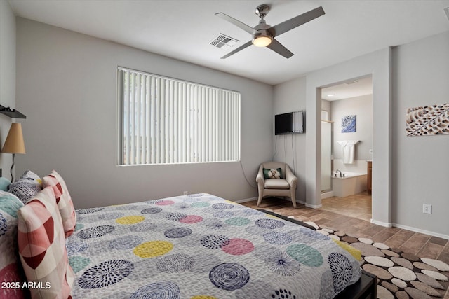 2328 W Calle Marita, Phoenix, AZ 85085 - bedroom with wood finished floors, ensuite bathroom, and baseboards