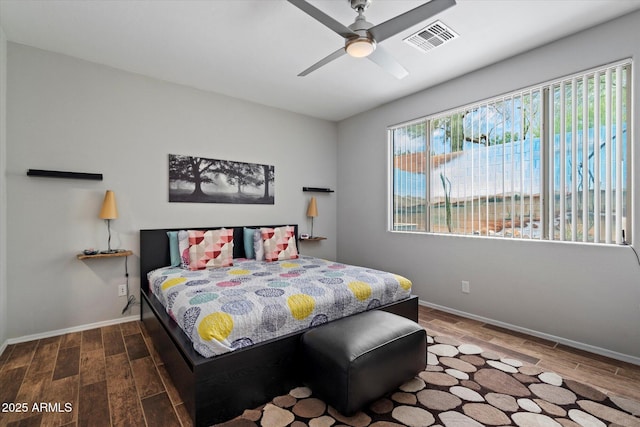 2328 W Calle Marita, Phoenix, AZ 85085 - bedroom with wood tiled floors, baseboards, and a ceiling fan