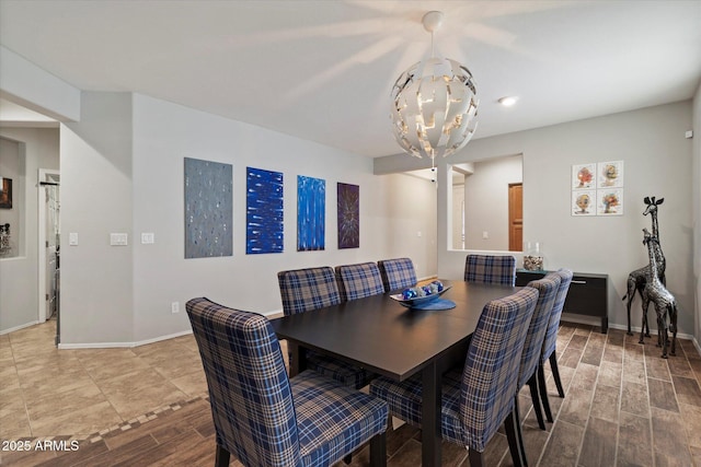 2328 W Calle Marita, Phoenix, AZ 85085 - dining space with a chandelier, wood finished floors, and baseboards