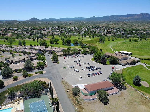 birds eye view of property with a mountain view