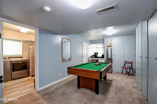 recreation room featuring washing machine and dryer, light colored carpet, and billiards