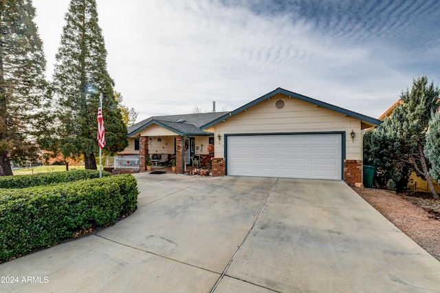 ranch-style home featuring a garage