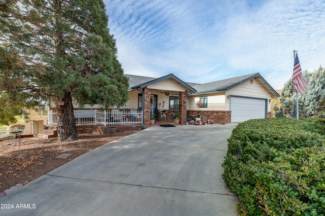 view of front of home with a garage and covered porch