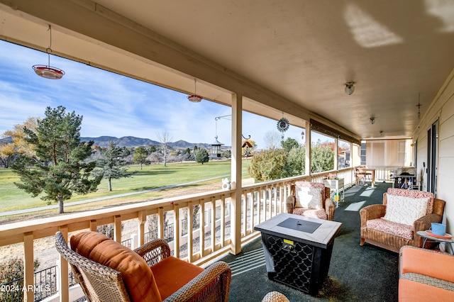 deck with a mountain view and a grill