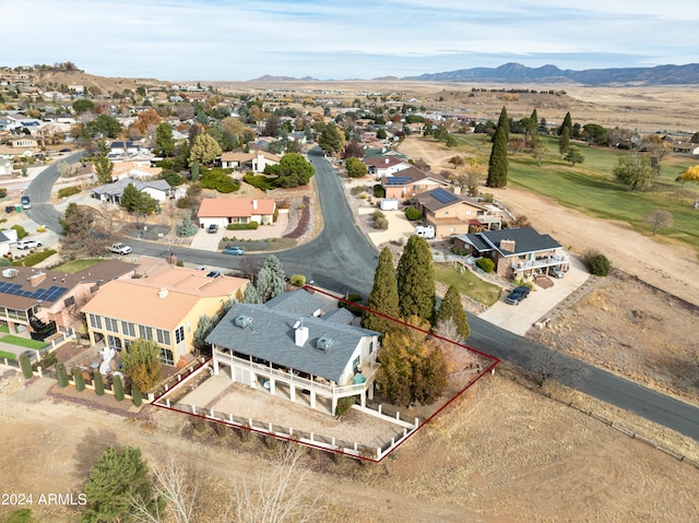 birds eye view of property with a mountain view