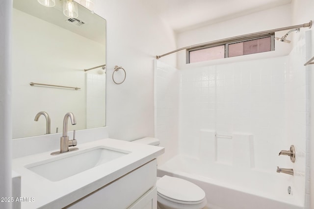 bathroom featuring vanity,  shower combination, visible vents, and toilet