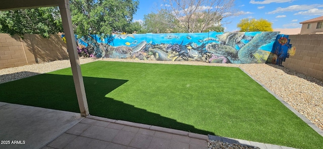 view of yard with a fenced backyard