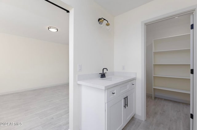 bathroom featuring hardwood / wood-style floors and vanity