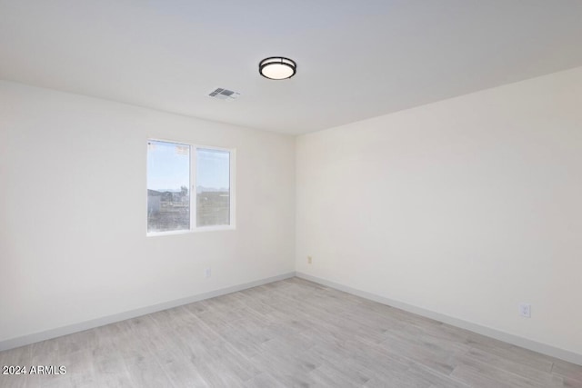 unfurnished room featuring light wood-type flooring