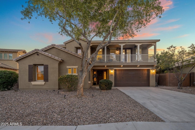 7616 S Sorrell Ln, Gilbert, AZ 85298 - view of front of property featuring a balcony, an attached garage, stucco siding, and concrete driveway