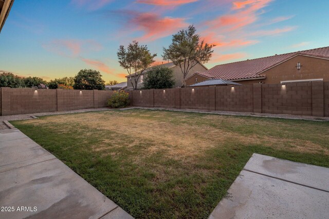 7616 S Sorrell Ln, Gilbert, AZ 85298 - yard at dusk with a fenced backyard