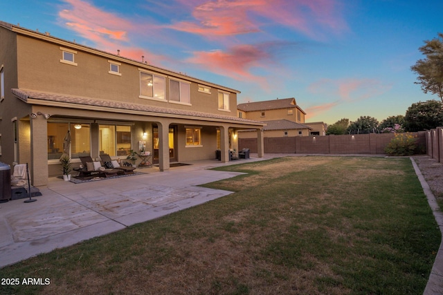 7616 S Sorrell Ln, Gilbert, AZ 85298 - back of house featuring a fenced backyard, stucco siding, a patio, and driveway