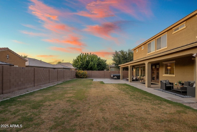7616 S Sorrell Ln, Gilbert, AZ 85298 - yard at dusk with an outdoor hangout area, a fenced backyard, and a patio area