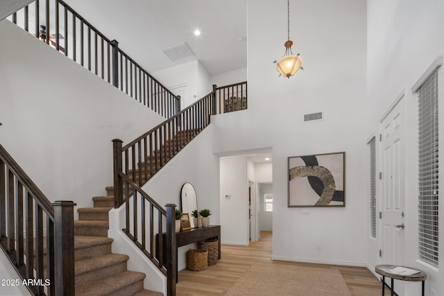 7616 S Sorrell Ln, Gilbert, AZ 85298 - entryway featuring wood finished floors, stairs, a high ceiling, and recessed lighting