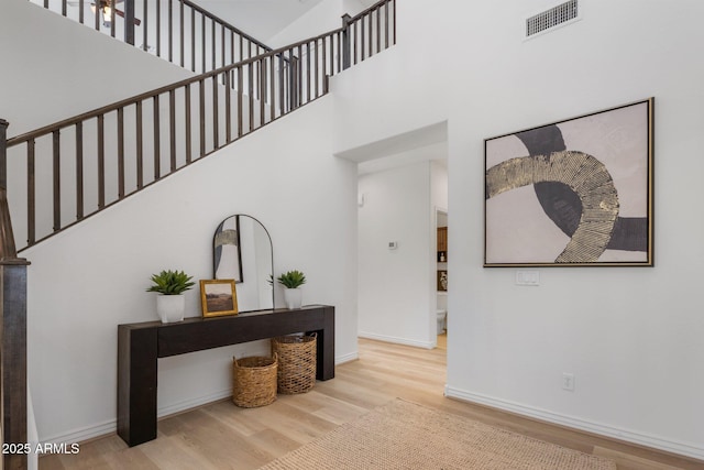 7616 S Sorrell Ln, Gilbert, AZ 85298 - stairs with wood finished floors and a towering ceiling