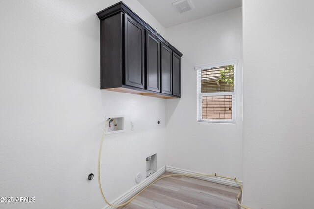 7616 S Sorrell Ln, Gilbert, AZ 85298 - laundry area with hookup for a gas dryer, hookup for an electric dryer, hookup for a washing machine, and light wood finished floors