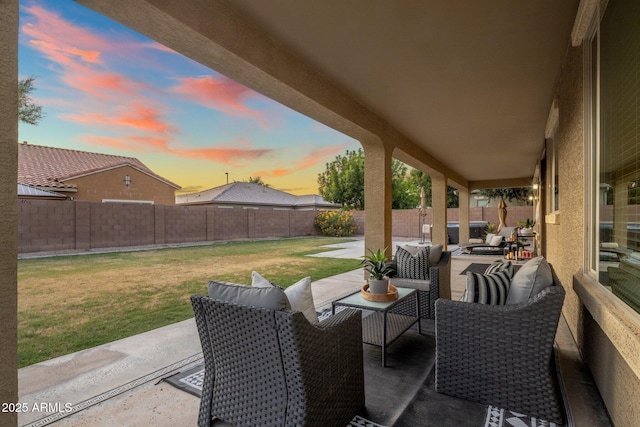 7616 S Sorrell Ln, Gilbert, AZ 85298 - patio terrace at dusk with an outdoor living space, a patio area, and a fenced backyard