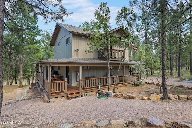 farmhouse inspired home with a balcony