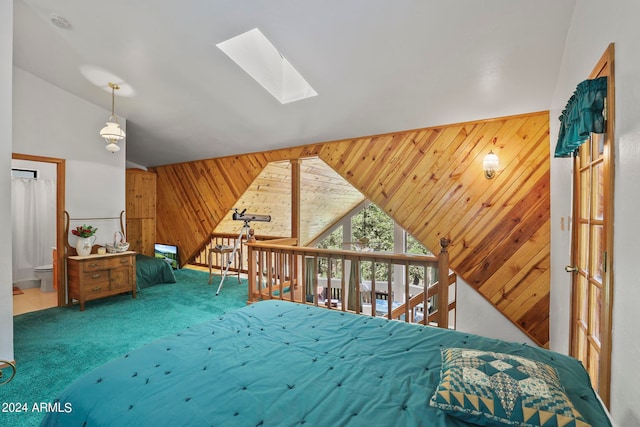 carpeted bedroom with vaulted ceiling with skylight and wood walls