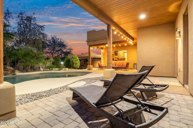 view of patio terrace at dusk