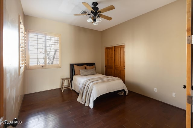 bedroom featuring ceiling fan and dark wood-type flooring