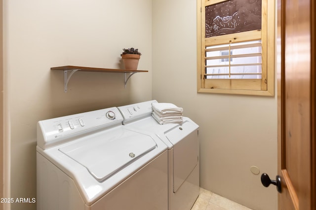 washroom featuring washer and clothes dryer