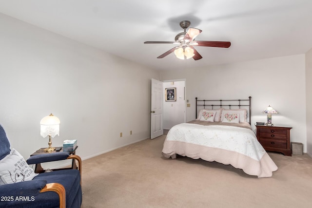 bedroom with ceiling fan and light carpet