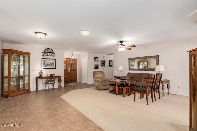 carpeted living room with ceiling fan