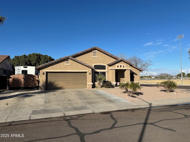 view of front of house featuring a garage and a mountain view