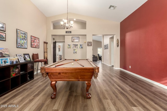 recreation room featuring an inviting chandelier, lofted ceiling, wood-type flooring, and billiards