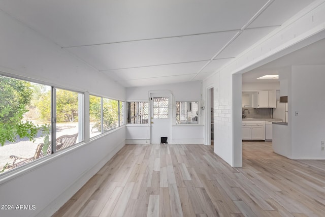 unfurnished sunroom with wood finished floors