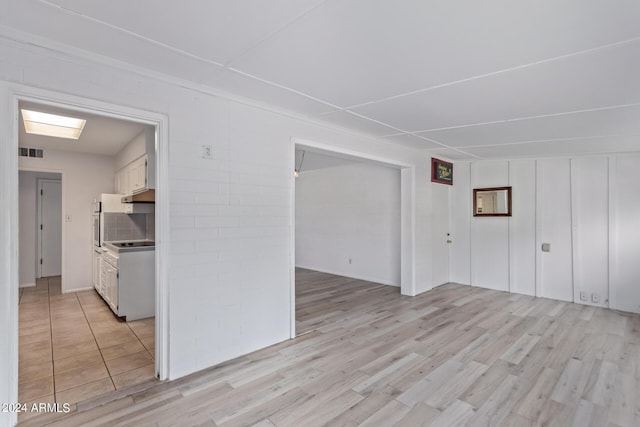 interior space featuring light wood finished floors and visible vents