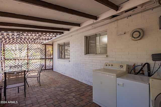 view of patio with outdoor dining area and washer / clothes dryer