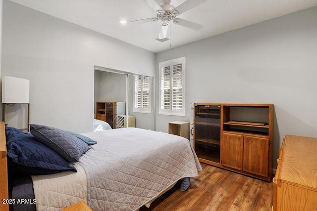 bedroom featuring a ceiling fan and wood finished floors