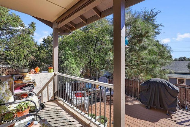 wooden terrace with area for grilling