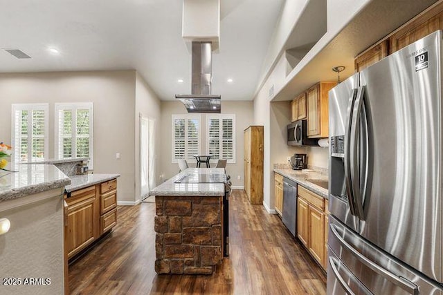 kitchen featuring appliances with stainless steel finishes, island exhaust hood, light stone counters, and dark wood-style floors