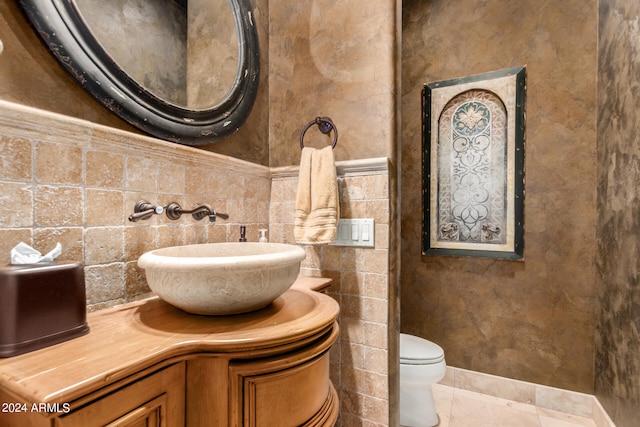 bathroom with tile patterned floors, decorative backsplash, vanity, and toilet