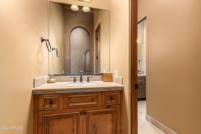 bathroom featuring vanity and tile patterned flooring