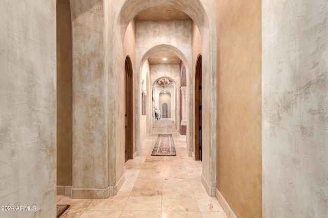 corridor with light tile patterned floors